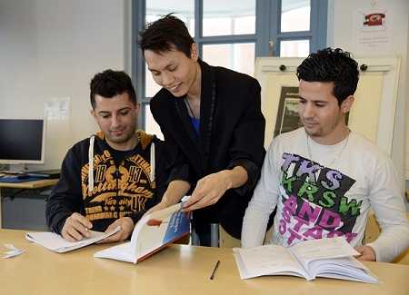 Kurdish Haval Hossa Ahmad (left), Vietnamese Le Van Hai and Algerian Benlarbi Bilal Finnish language lesson immigrants vocational education vocational trail in Helsinki on February 27, 2013. Photo Lehtikuva