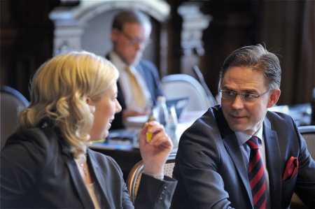 Govt defends budget plan as oppositions criticize