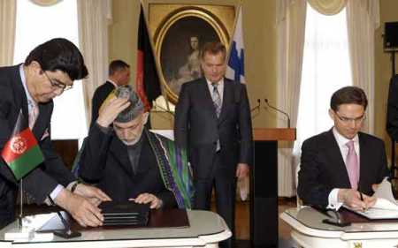 Karzai, Katainen sign cooperation accord