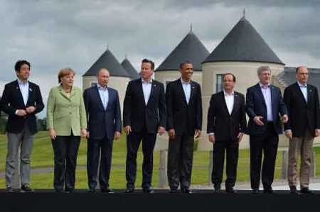 File picture,G8 leaders (L-R) Japan's Prime Minister Shinzo Abe, Germany's Chancellor Angela Merkel, Russia's President Vladimir Putin, Britain's Prime Minister David Cameron, US President Barack Obama, France's President Francois Hollande, Canada's Prime Minister Stephen Harper and Italy's Prime Minister Enrico Letta stand on the podium for the family photograph on the second day of the G8 summit at the Lough Erne resort near Enniskillen in Northern Ireland on June 18, 2013. Russia and the US agreed at the G8 summit to push for Syria peace talks, but Presidents Vladimir Putin and Barack Obama made clear their deep differences over the conflict. Photo AFP / Lehtikuva