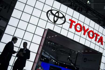 (FILES)People are seen near the Toyota display during the Washington Auto Show in this January 22, 2014 file photo in Washington, DC. Toyota Motor Corp. will pay $1.2 billion to settle US accusations that it sought to cover up an accelerator problem in Toyota and Lexus vehicles tied to numerous accidents and deaths. The US Justice Department said the Japanese auto maker admitted to misleading regulators and the public about the safety problems in its cars in 2009 and 2010. Photo AFP-Lehtikuva