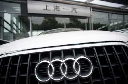 An Audi car is pictured in front of a car seller in Shanghai on August 6, 2014. German luxury car maker Audi and Chrysler of the United States have committed