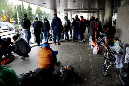 Refugees queue in front of the Pasila police station in Helsinki on Monday September 14. Photo Lehtikuva.