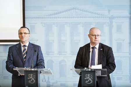 The government counsellor, Harri Hietala on Thursday handover the report to Justice and Labour Minister Jari Lindström in Helsinki on Thursday. Photo – Str / Lehtikuva.