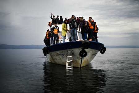 Refugees and migrants arrive by boat on the Greek island of Lesbos after crossing the Aegean sea from Turkey on October 11, 2015. Greece was hit by a huge new surge in migrants as the United Nations on October 9 approved a European seize-and-destroy military operation against people smugglers in the Mediterranean. Photo AFP-LEHTIKUVA