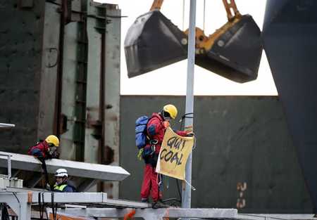 Greenpeace activists demonstrated to protest against the use of coal in Helsinki on Monday. Photo – Lehtikuva.